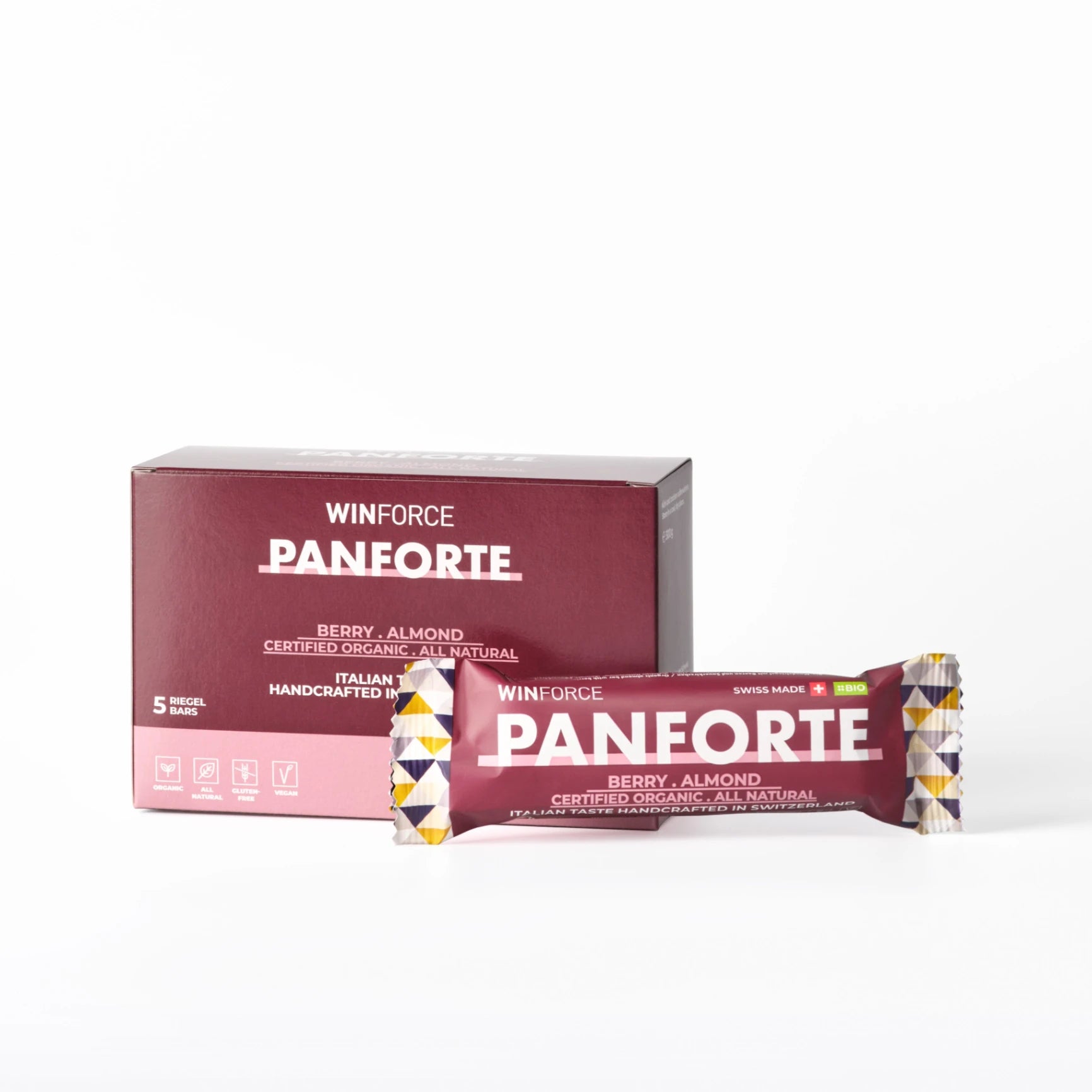 Eine Packung Winforce Panforte Beeren-Mandel Riegel (5 Stück) und ein einzelner Riegel. Die dunkelrote Verpackung betont BIO-Qualität, "Swiss Made", "Organic", "Gluten-Free" und "Vegan" für natürliche Sporternährung.