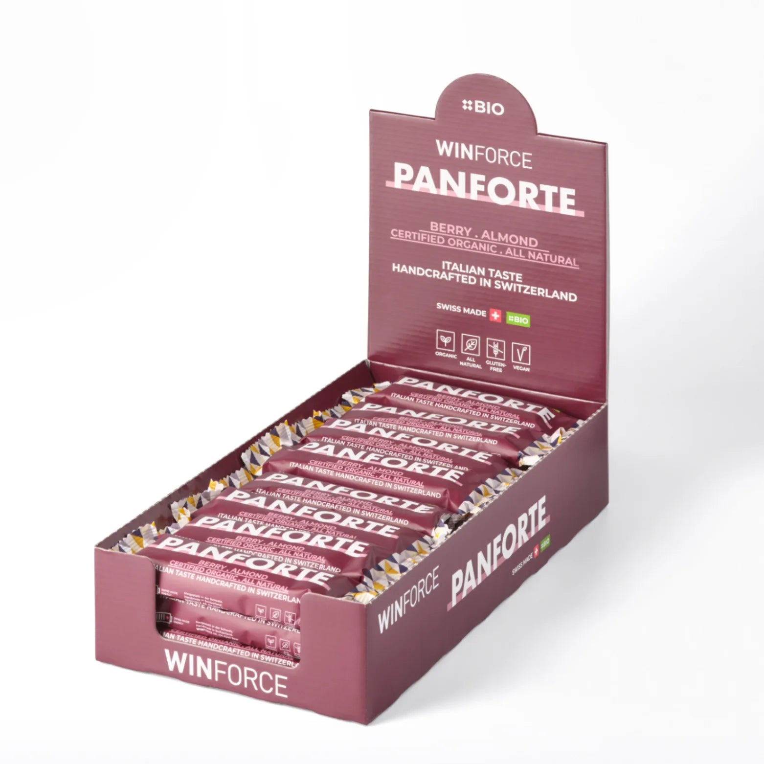 Ein Theken-Display mit mehreren WINFORCE PANFORTE Bio-Energie-Riegeln der Sorte Beere-Mandel, die als zertifiziert organisch, natürlich, glutenfrei und vegan beworben werden, handgefertigt in der Schweiz.